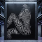A large 96x120 inch wall-mounted multi-print artwork in a dark industrial interior, featuring a stylized human female figure formed by dense white curved stripes on a black background.